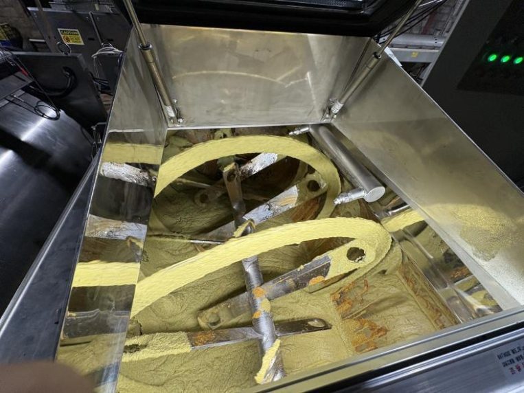 Inside a malaxer, where avocado paste is slowly mixed to release oil